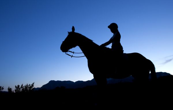 Horseback riding with a full moon